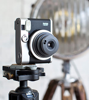 Fujifilm goes Polaroid-esque with neoclassical Instax Mini 90.