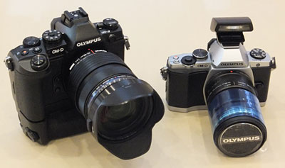 With the battery grip added, the E-M1 looks distinctively bulkier and more DSLR-like than its E-M5 predecessor.