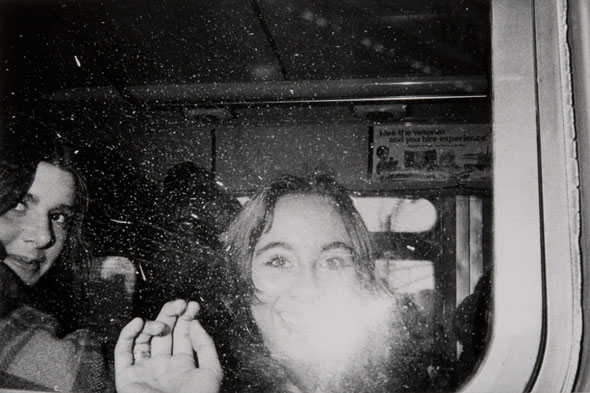 Untitled (girls' faces flashed in the bus window) | Mark Cohen