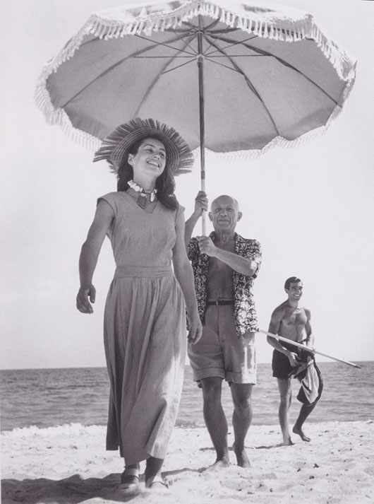 Golfe-Juan, France, August 1948: Pablo Picasso and Francoise Gilot. The man in the background is Picasso’s nephew, Javier Vilato. | Robert Capa.