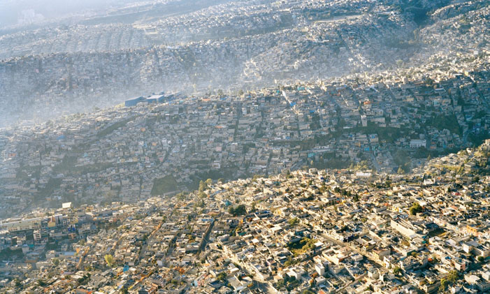 Waves of Humanity Sprawling Mexico City rolls across the landscape, displacing every scrap of natural habitat. "If our species had started with just two people at the time of the earliest agricultural practices some 10,000 years ago, and increased by one percent per year, today humanity would be a solid ball of flesh many thousand light years in diameter, and expanding with a radial velocity that, neglecting relativity, would be many times faster than the speed of light." (Gabor Zovanyi) | Pablo Lopez Luz / Population Speak Out