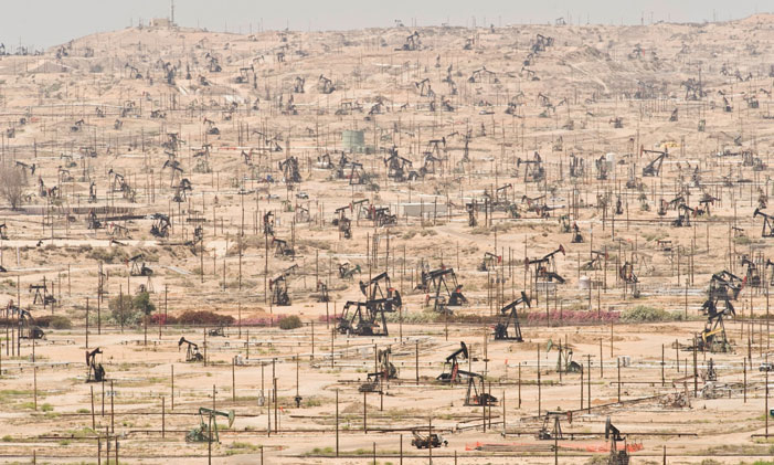 Oil Wells Depleting oil fields are yet another symptom of ecological overshoot as seen at the Kern River Oil Field in California "I don’t understand why when we destroy something created by man we call it vandalism, but when we destroy something created by nature we call it progress." (Ed Begley, Jr.) | Mark Gamba/Corbis / Population Speak Out 